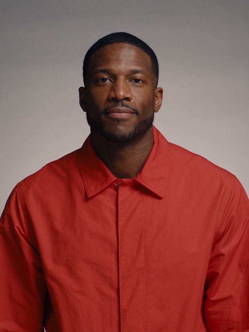 AI-generated left performer reference, red jacket